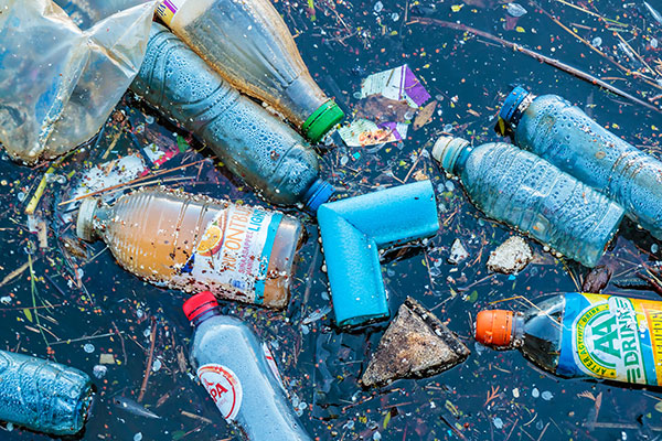 Plastic litter floating in water