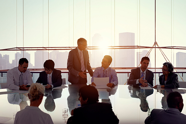 People sitting around a meeting table