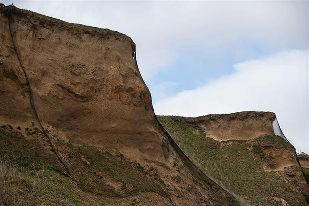 North Norfolk District Council courted controversy when it used nets along a stretch of the Bacton Cliffs while it carried out a sandscaping project. Photograph: Dan Kitwood/Getty