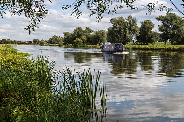 Canal boat on the river Ely