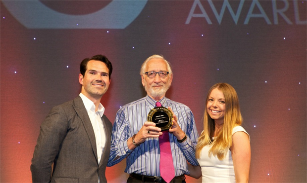 Derek Walder, centre - receives his AEO Unsung Hero Award from TV personality Jimmy Carr and Samantha Edwards from category sponsor Event Magazine