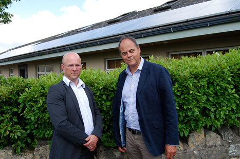 Dr Eavis (l) and solar panel installer Steve Barrett