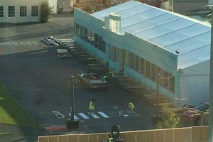 Workers seen painting the venue two hours after start time (Paul Monks)