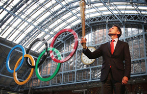 Seb Coe holds the Olympic torch