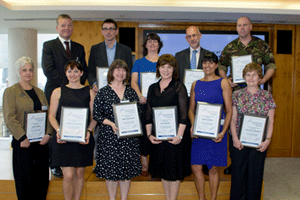 Kevan Collins, chief executive Tower Hamlets Council (back left), with left to right Mark Campbell and Cathy Jones from Clifford Chance, Christopher Hooper, ex-Lloyd's of London, Warrant Officer David Lawson. Front row (left to right): Jenny Dawes fr