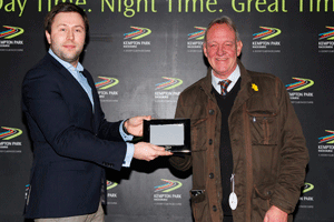 Duncan Miller presents the winner of the Event magazine stakes with his prize