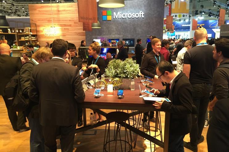 Microsoft, Huawei and Sony each used natural wood textures to add warmth to their stands