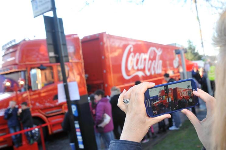 Residents of Ayr in Scotland visiting Coca-Cola's Christmas truck