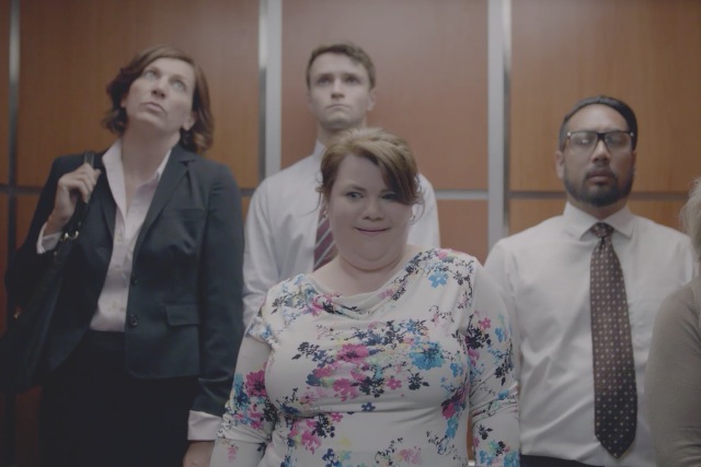 Zumba ad: a woman in a lift prepares to start busting moves