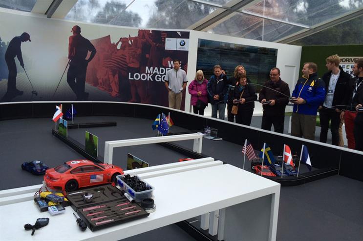 The BMW activation will let guests race in miniature cars
