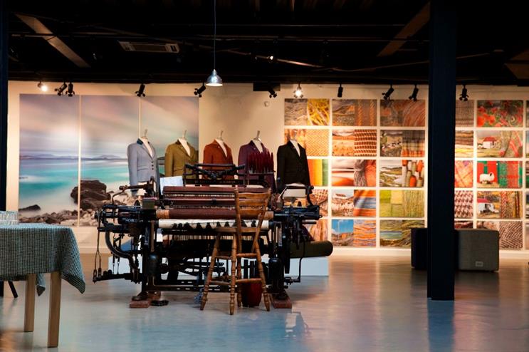 A working loom acts as a centrepiece to the exhibition