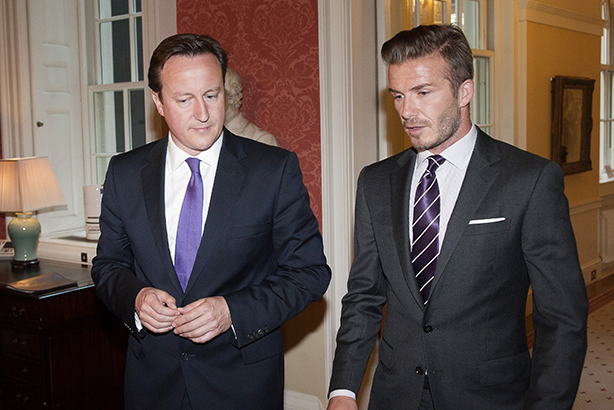 Teaming up: Cameron and Beckham (Credit: David Parker/AFP/Getty Images)