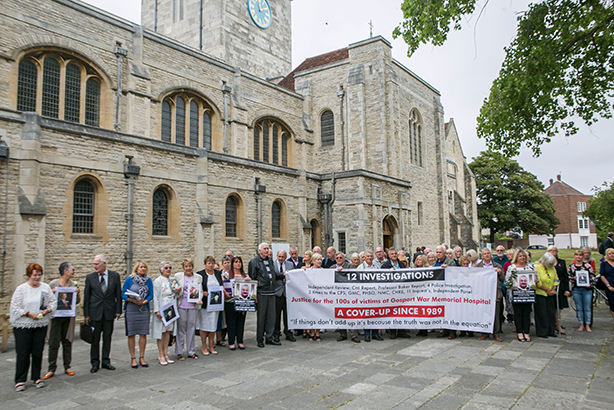 Relatives of people affected by the scandal hold banners ahead of the inquiry's report (Pic credit: Brighton Pictures/REX/Shutterstock)