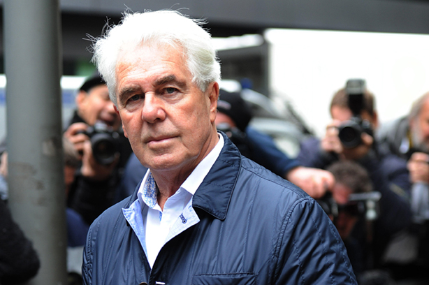 Clifford arrives at his sentencing at Southwark Crown Court in 2014 (©Splash News/Alamy Stock Photo)