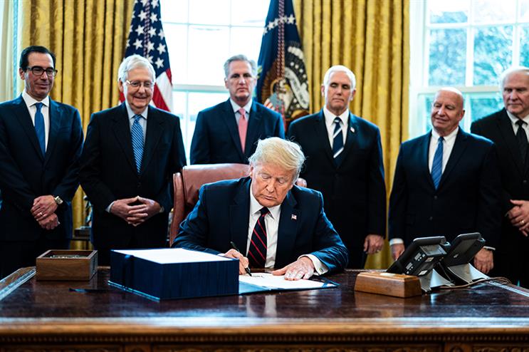 President Trump signs business relief into law last Friday. (Photo credit: Getty Images)