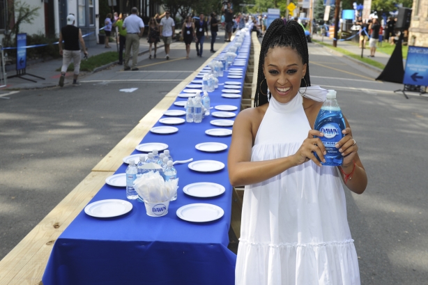 Actress Tia Mowry in front of the 2,000-foot table that seated a New Jersey town