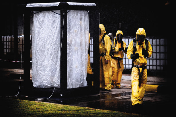 Workers wearing hazmat suits, in one of the images in the new guidance produced by the CIPR and CPNI
