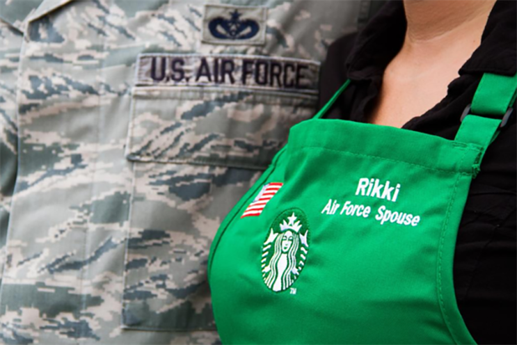 Embroidered flags adorn the aprons of Starbucks staffers who are veterans or military spouses.
