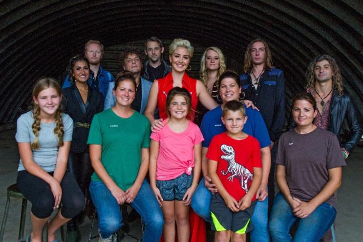 Artist Maggie Rose with female farmers and their families