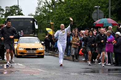 Dr Tim Sowton during his run with the Olympic torch