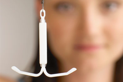 IUD contraceptive being held by a woman (Photo: SPL)