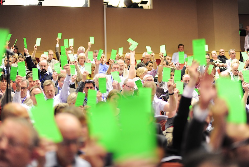 LMC conference delegates voting using cards