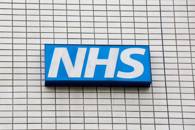 NHS logo on tiled wall