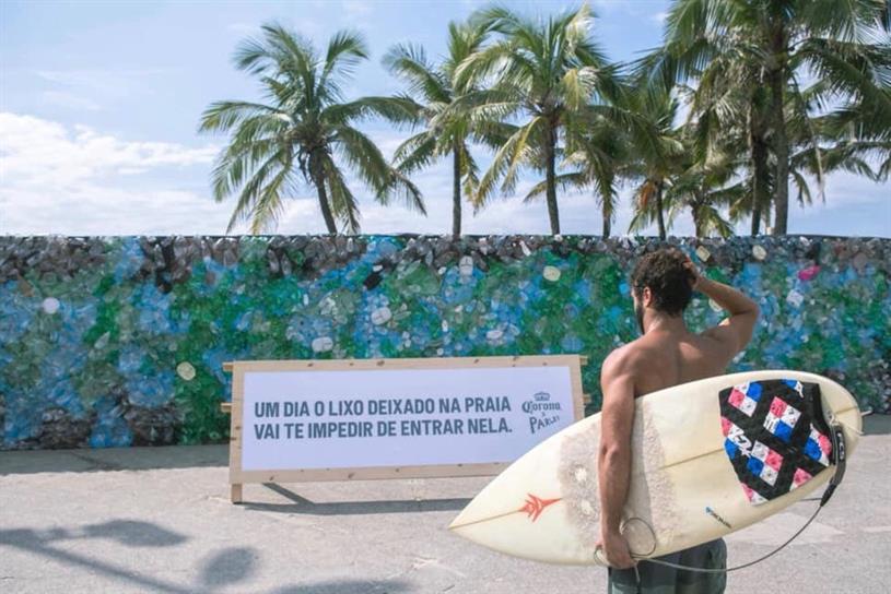 A surfer finds his way blocked to Ipanema Beach