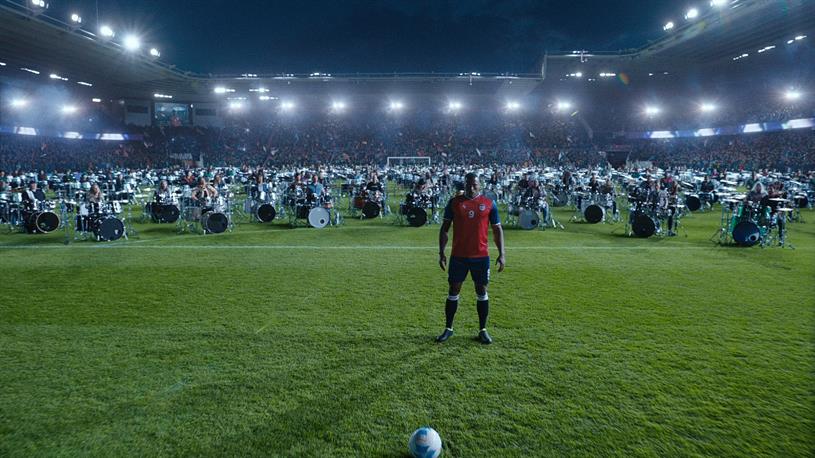 A player backs nervously away from the ball - his heartbeat beating to the rhythm of hundreds of drummers