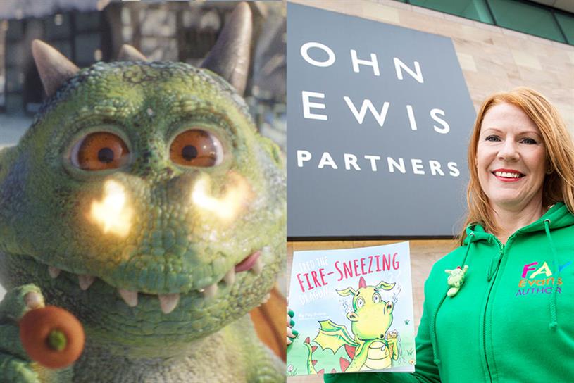 Edgar the dragon with flames around his nostrils and author Fay Evans holding her book 
