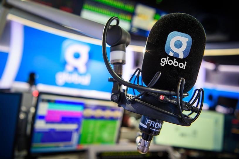 A microphone bearing the Global logo in a radio studio.