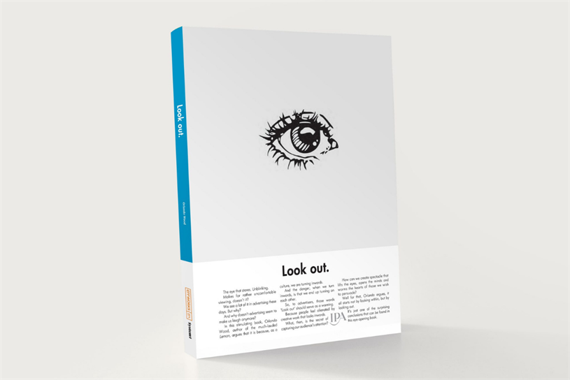 An image of Orlando Wood's new book, 'Look Out', its white cover featuring a sketch of a single eye, while its blue spine contrasts with the whiteness of the overall image. 