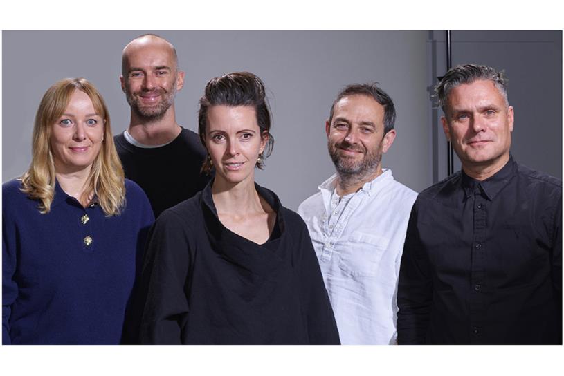 Portrait of the five creatives standing together in a group