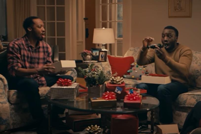 Extra Gum holiday ad with two men opening Christmas presents