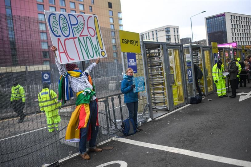 Protesters outside the entrance to the COP26 summit on November 1, 2021 in Glasgow, United Kingdom. (Credit: Getty)