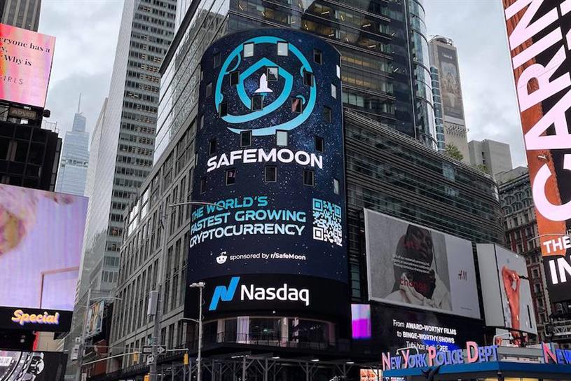 Times Square video display showing cryptocurrency SafeMoon branding