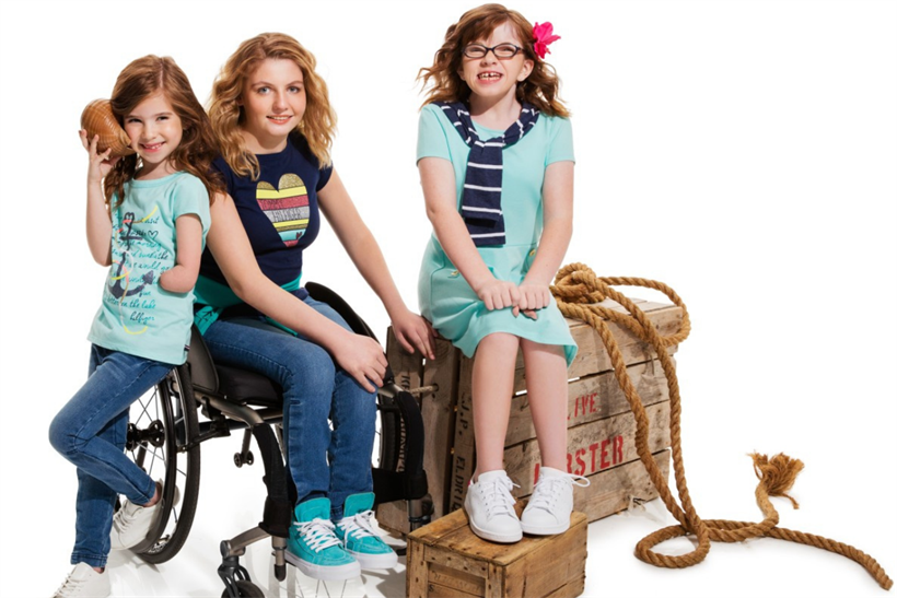 Three disabled girls pose, dressed in Tommy Hilfiger's Tommy Adaptive collection