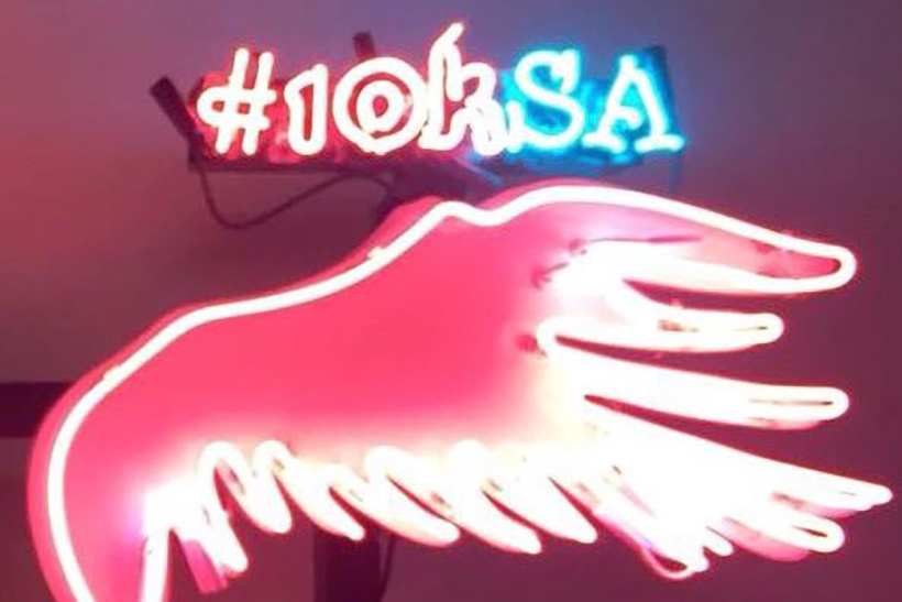 Princess Reema asked SXSW attendees to take photos in front of pink neon wings and share them via the hashtag #10KSA.