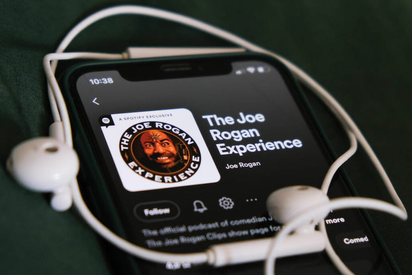 Joe Rogan Experience podcast art on iPhone screen