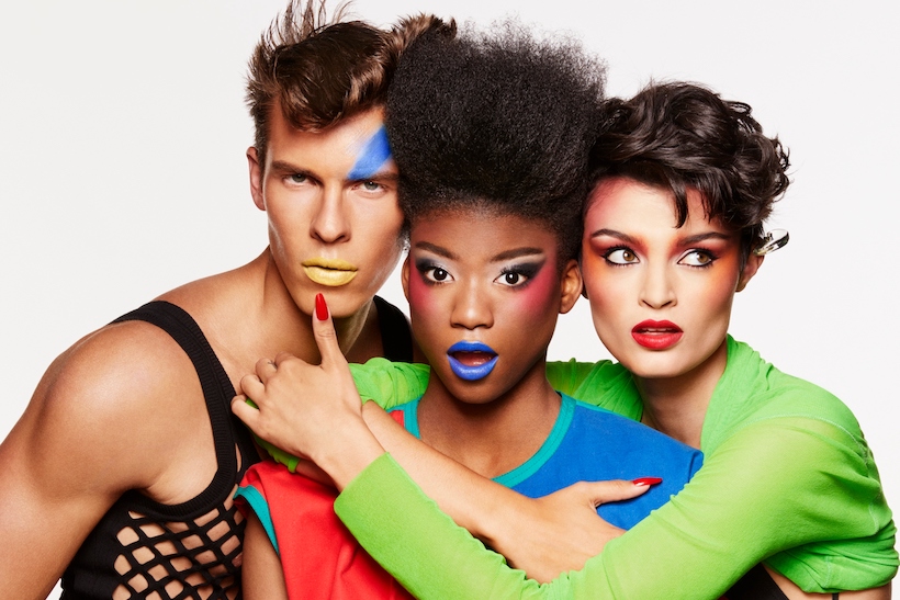 Male and female models wearing the Viva Glam x Keith Haring lipstick collection