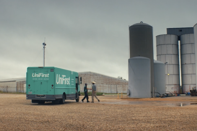 UniFirst truck outside farm silos