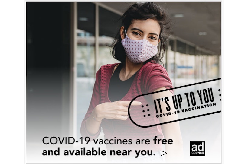 The Ad Council's "It's Up To You" COVID-19 ad campaign showing masked woman pointing at her arm.