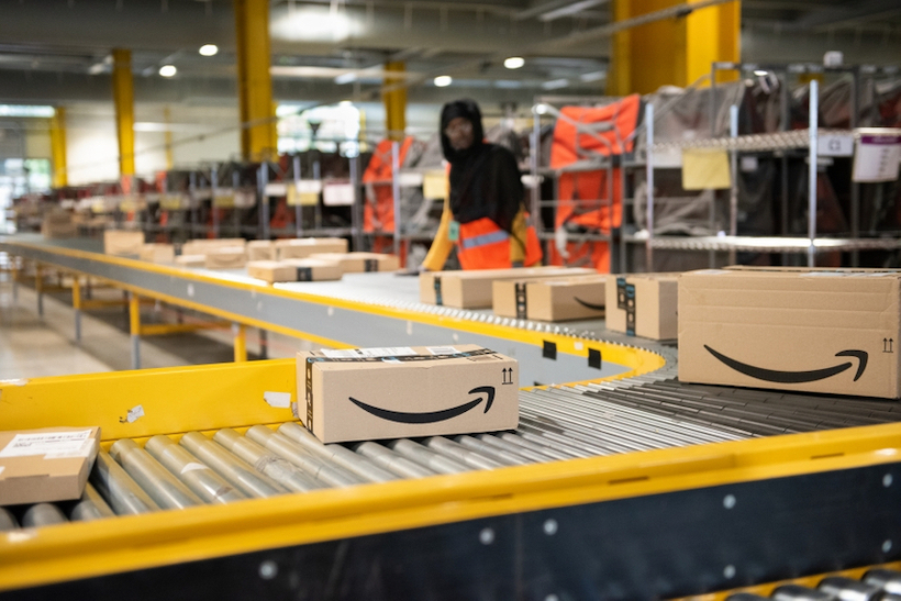 Amazon boxes on a conveyor belt in Amazon warehouse