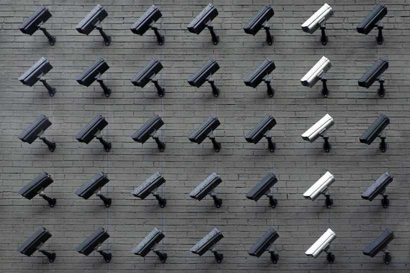 Security cameras on brick wall
