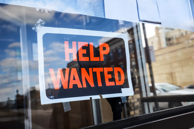 "Help wanted" sign in store window