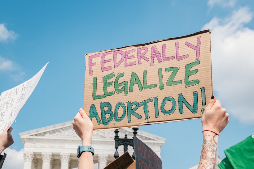 Pro-choice demonstrator holds a "Federally Legalize Abortion" sign outside the Supreme Court
