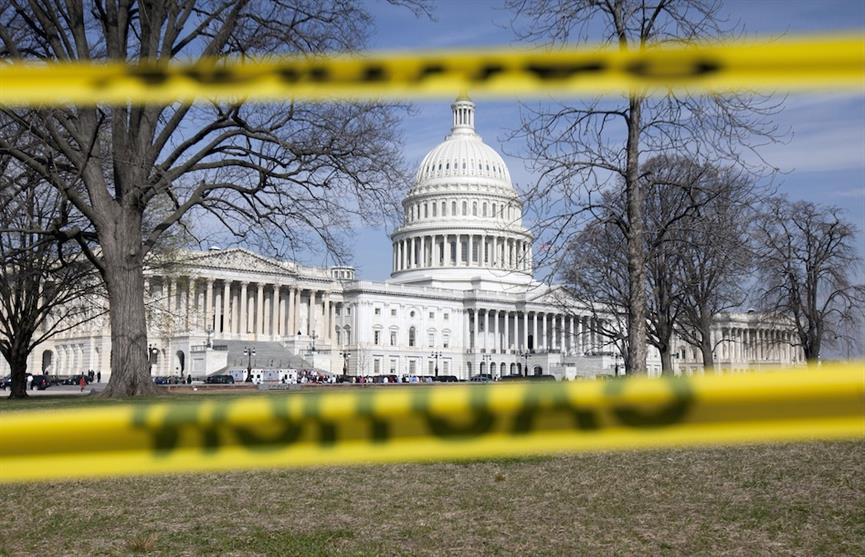 Image of the US Capitol behind caution tape