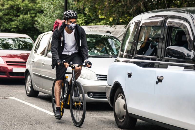 A cyclist wearing an anti-pollution mask