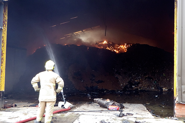 The material brought onto the site caught fire at least twice in the summer of 2014. Photograph: Natural Resources Wales