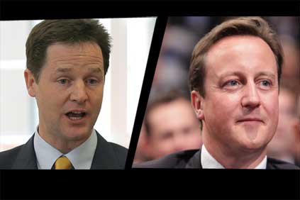 Awkward fit: Clegg (left) and Cameron set for coalition talks 